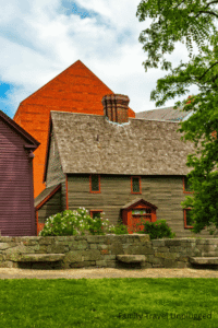 Kids and parents exploring the enchanting streets of Salem Massachusetts, enjoying historical sites and interactive exhibits.