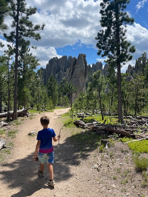 Child hiking a trail at Custer State Park