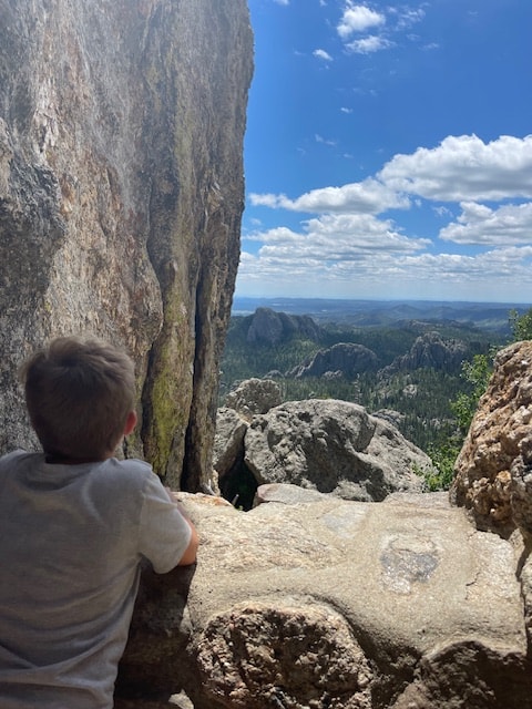 A family hiking at a trip to Custer State Park with kids.