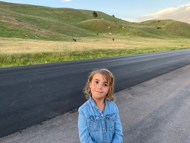 A family enjoying wildlife encounters at Custer State Park with kids.