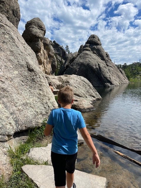 A family having fun at Sylvan Lake in Custer State Park.