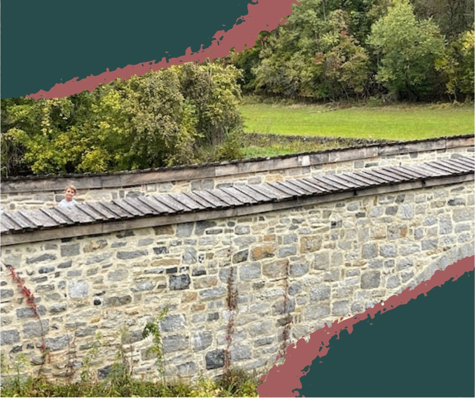 Burnside Bridge, surrounded by trees and reflected in the still creek below, stands as a silent witness to the events of the Battle of Antietam.