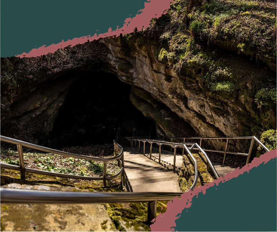 View from outside looking into the cave entrance at Mammoth Cave National Park, a UNESCO World Heritage Site known for its vast underground cave system.