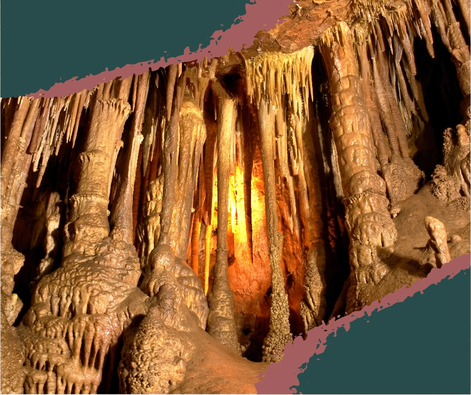 Massive stalagmites rising from the ground inside the underground cave system at Mammoth Cave, the world’s longest cave, with formations formed over thousands of years.