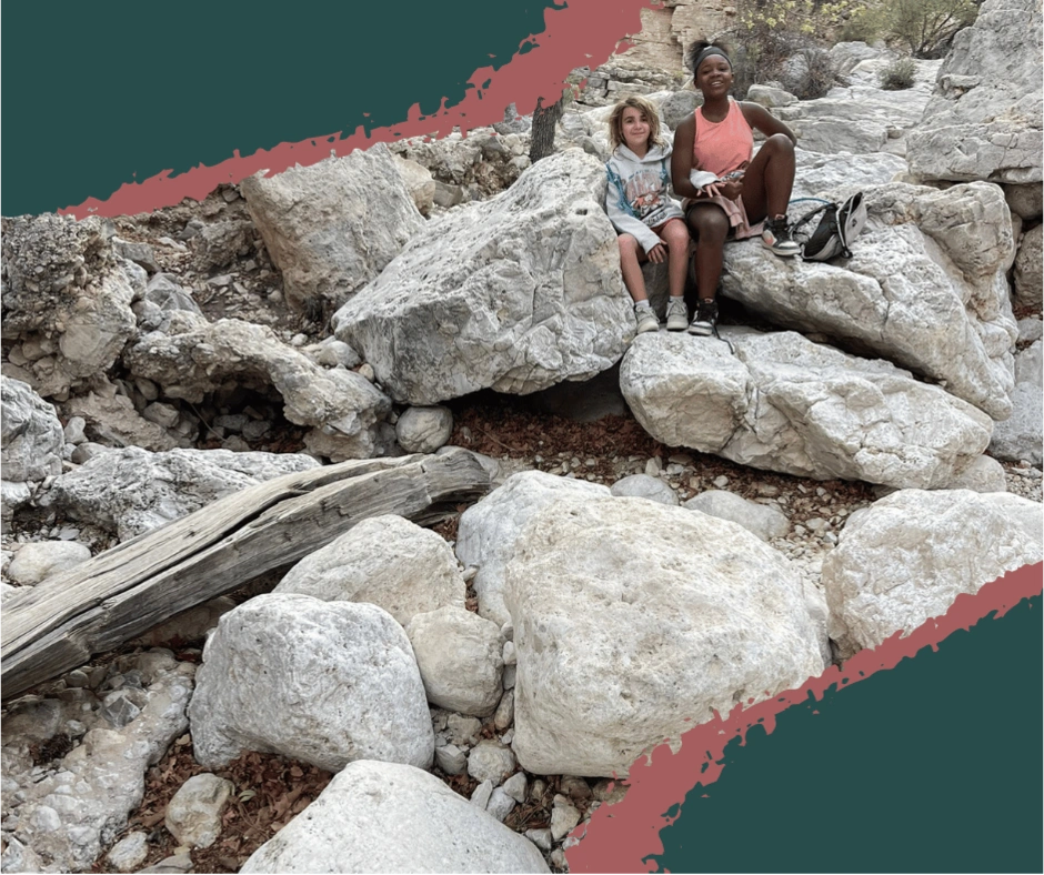 Family climbing stone steps on a canyon trail in Guadalupe Mountains National Park