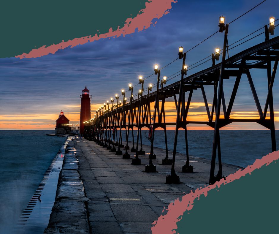 Red Grand Haven lighthouses on the Lake Michigan pier with waves crashing along the catwalk. Grand Haven MI.