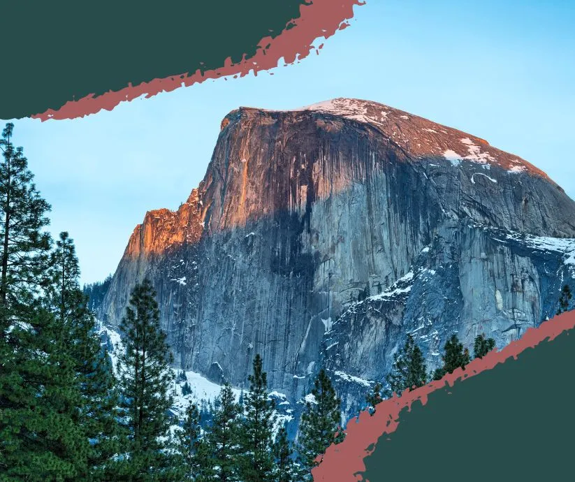 Hiker reaching the summit of Half Dome in Yosemite with dramatic views