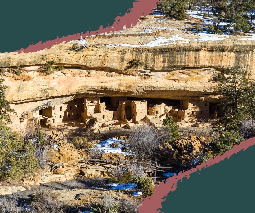 Cliff Palace as seen from across the canyon, built into the massive sandstone cliff with the Four Corners region stretching behind.