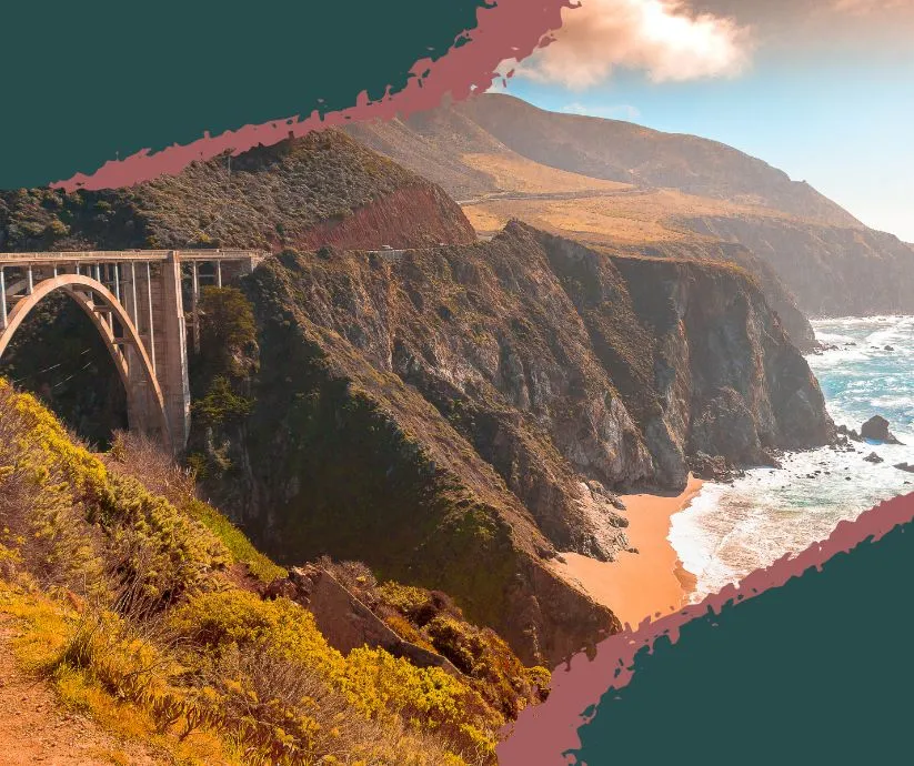 Car driving along California’s Pacific Coast Highway beside cliffs and the ocean