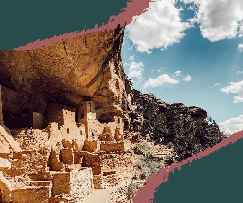 A panoramic view of Cliff Palace, the largest cliff dwelling in Colorado Mesa Verde National Park, built into sandstone canyon walls.